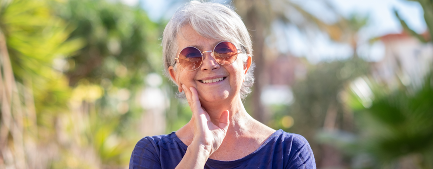 Life Assure Senior Woman Sitting In Chair And Laughing With Caregiver Nurse Hero